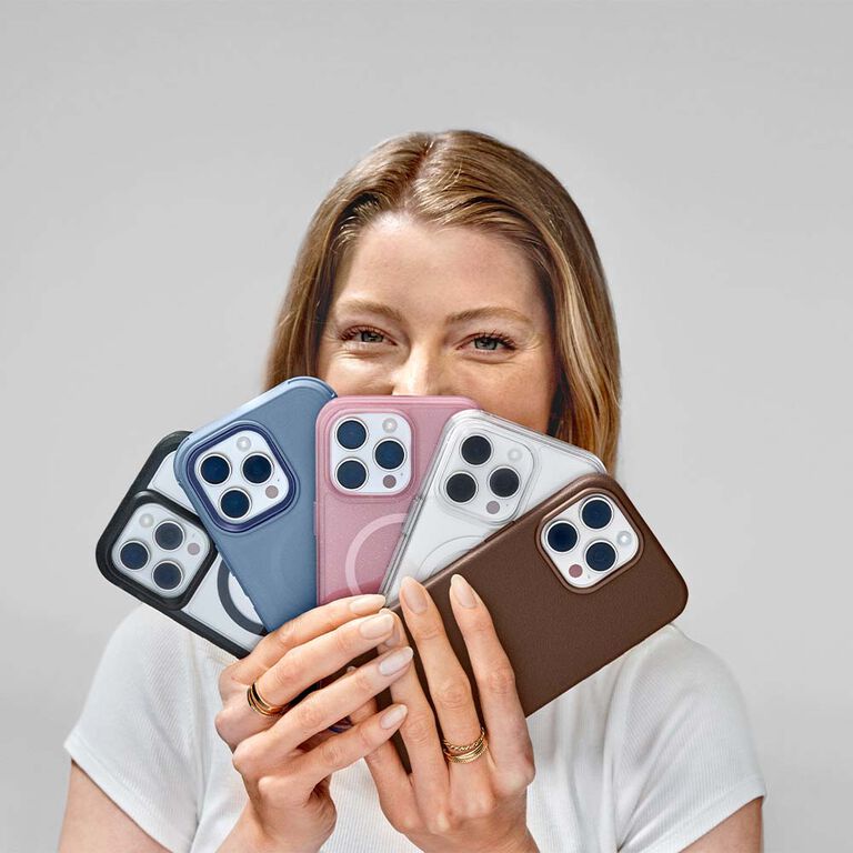 Woman holding multiple iPhone 16's with trendy cases | OtterBox